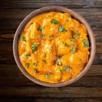 Fischfilet in cremiger Kokosnuss-Masala-Sauce mit südindischen Gewürzen – serviert bei India4U Bern