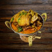 Knusprige Entenstücke in pikanter Masalasauce – serviert bei India4U Bern