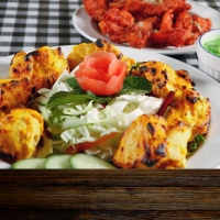 Mariniertes Fischfilet vom Grill mit Tandoori-Gewürzen, serviert im India4U Bern